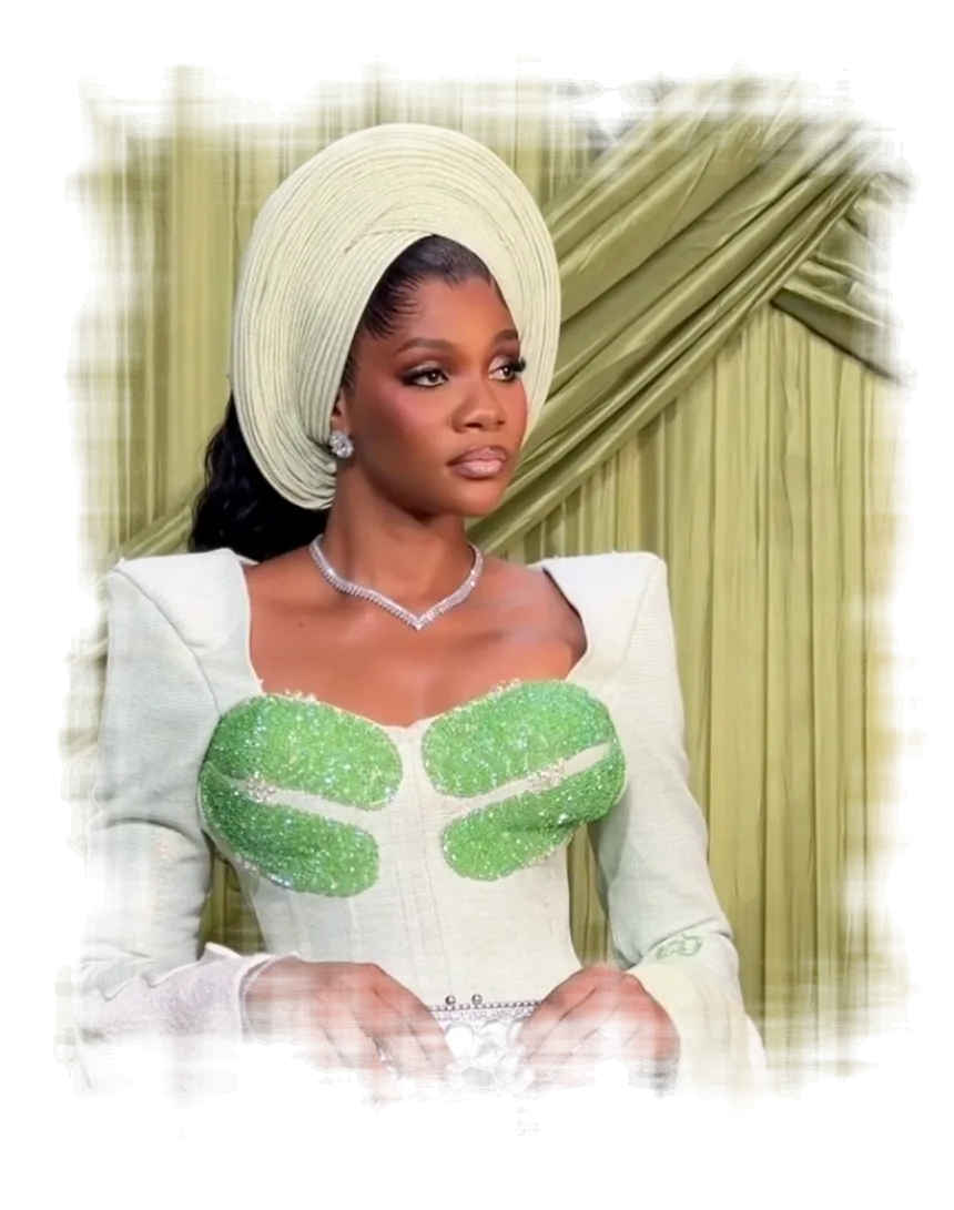 Woman in a sage-green autogele and embellished outfit